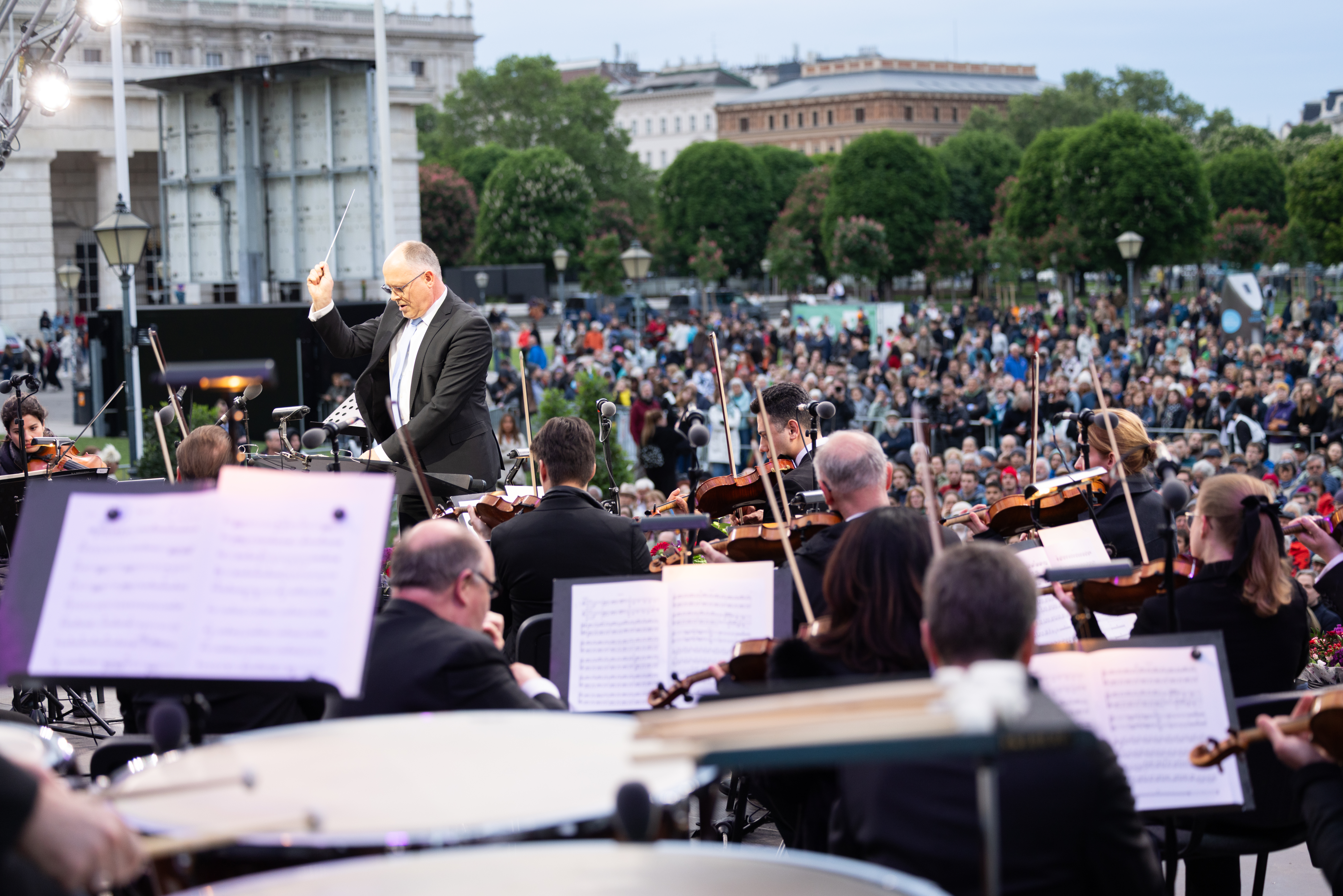 A string quartet performing before an audience on stage.